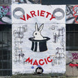 Graffiti art on a wall with 'VARIETY MAGIC' and a rabbit in a hat design.