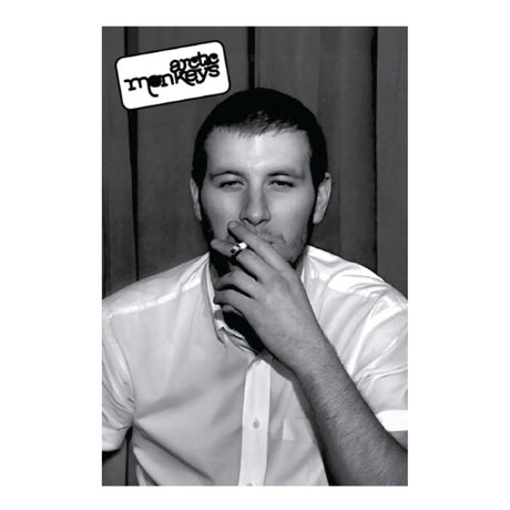 Black and white photo of a man smoking with ' Arctic Monkeys ' logo above