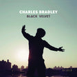 Album cover with silhouette of a person against a city skyline and sunset, featuring the text 'Charles Bradley Black Velvet' on a teal background.