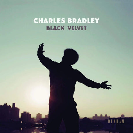 Album cover with silhouette of a person against a city skyline and sunset, featuring the text 'Charles Bradley Black Velvet' on a teal background.