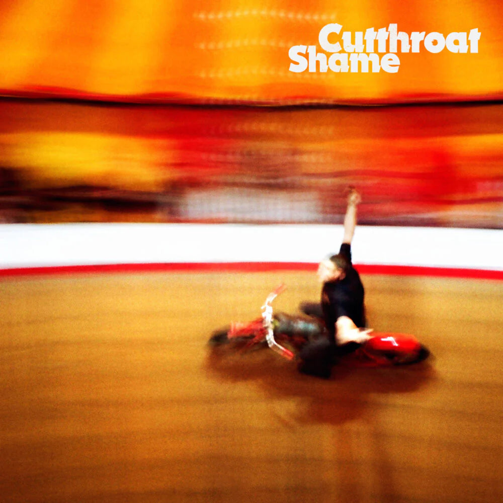 Person on a motorcycle with 'Cutthroat Shame' text overlay
