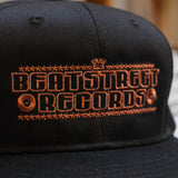 Beat Street Snapback Hat - Black with Brown Logo