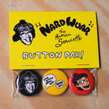 Button pack with 'Nardwuar the Human Serviette' design on a yellow card, displayed on a wooden surface.