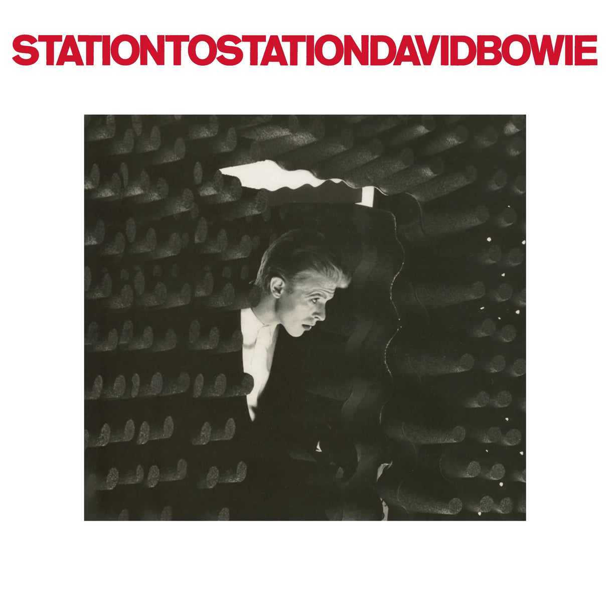 Album cover with a person peering through a textured surface, featuring the text 'Station to Station David Bowie'.
