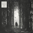 Album cover with a person walking through a forest, titled 'The Weight of the Woods' by Dermot Kennedy.
