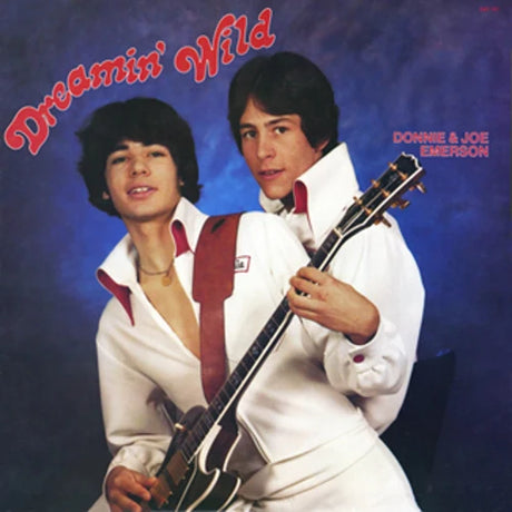 Album cover featuring two individuals with a guitar, set against a blue background with 'Dreamin' Wild' text.