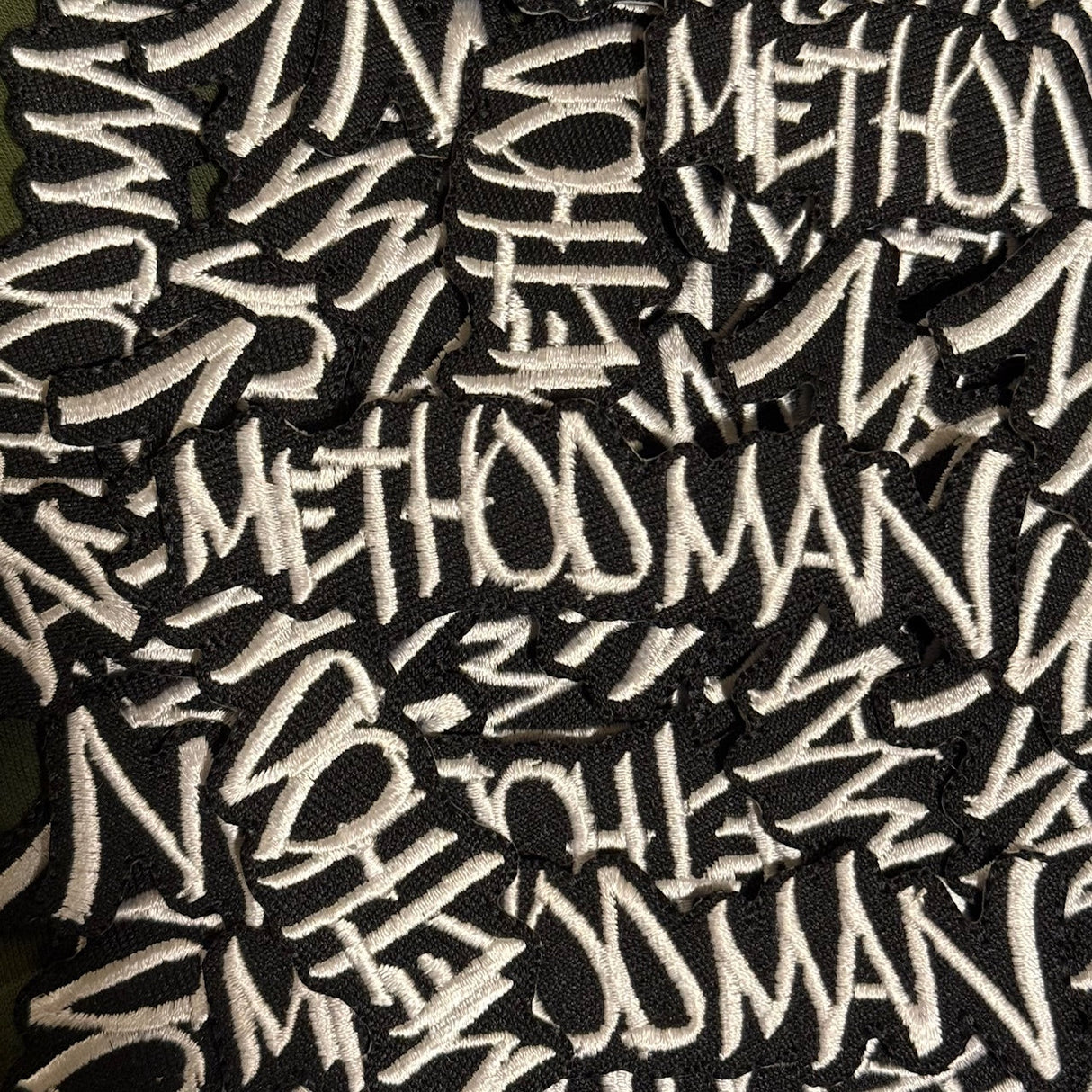 Pattern of 'Meth' text on a black background