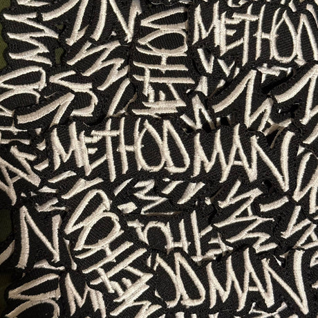 Pattern of 'Meth' text on a black background
