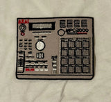 Embroidered patch of a music synthesizer on a beige fabric background