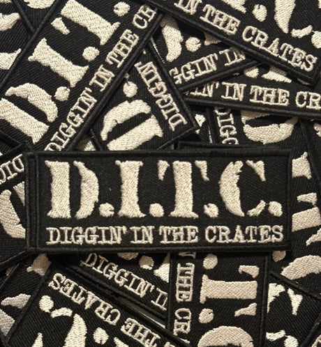 Black and white patches with 'D.I.T.C. Diggin' in the Crates' text on a pile of similar patches.