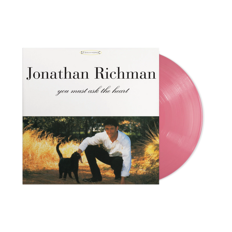 Vinyl record with a cover featuring a man and a dog in a field, labeled 'Jonathan Richman you must ask the heart'.
