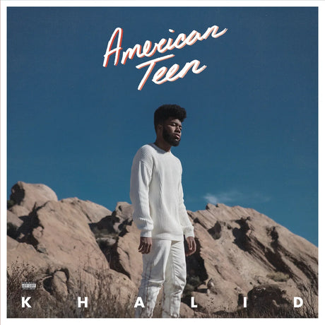 Album cover with a person standing on rocky terrain under a clear blue sky, featuring the text 'American Teen' and 'Khalid'.