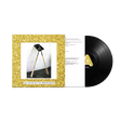 Vinyl record with gold glitter cover and black disc on a white background