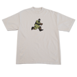 Beige t-shirt with a graphic of a character in green pants and brown shoes on a white background