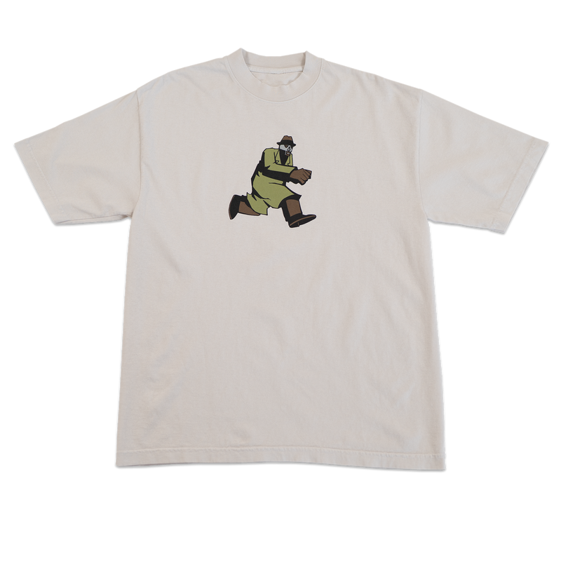 Beige t-shirt with a graphic of a character in green pants and brown shoes on a white background