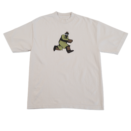 Beige t-shirt with a graphic of a character in green pants and brown shoes on a white background