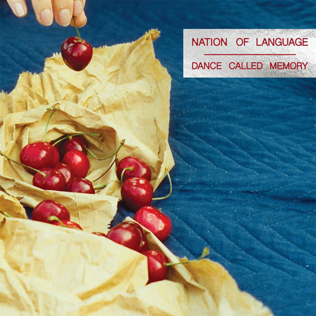 Cherries on a yellow cloth with a blue background and text overlay