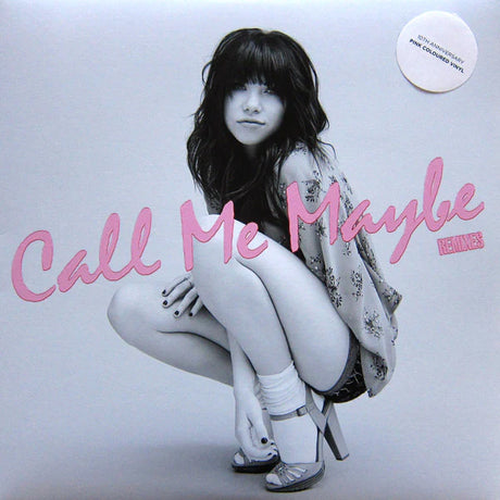 Album cover with a person squatting, featuring the text 'Call Me Maybe' in pink.