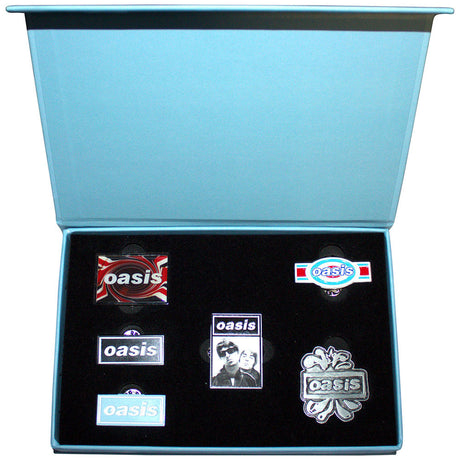 Set of Oasis pins in a blue box on a white background