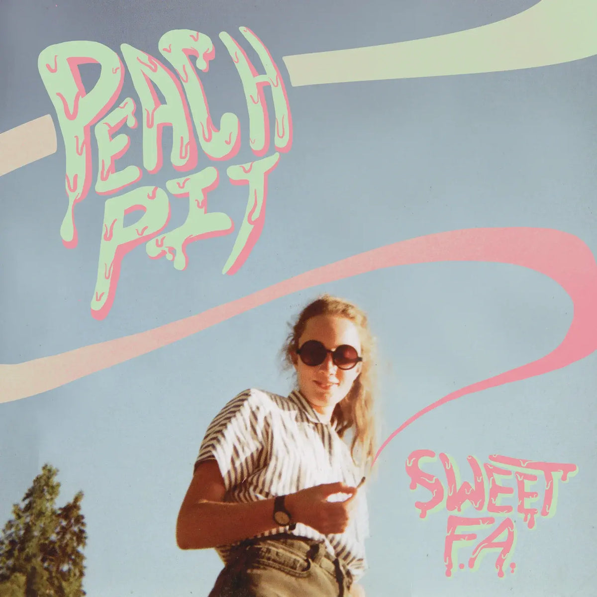 Album cover art for 'Sweet FA.' by Peach Pit, featuring a young woman in sunglasses and a striped shirt against a light blue sky background with retro pink and cream graphic lines and stylized text.