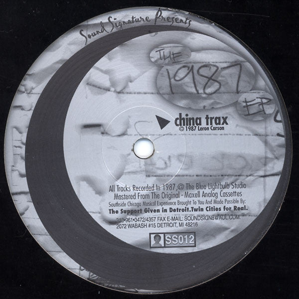 Record label with text and branding on a black background