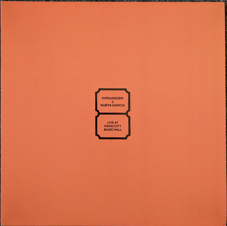 A solid orange colored album cover with text that reads 'Khruangbin & Nubya Garcia Live at Radio City Music Hall'.