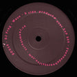 Vinyl record label with text on a black background