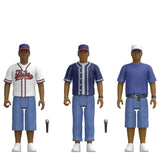 Three stylized action figure characters shown side by side on a plain white background, each wearing a baseball-style uniform and holding a small microphone. The figures appear to be collectible toys rather than real people, and no real environment is present.
