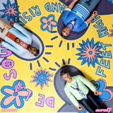 Toy figures on a colorful mat with text and floral designs