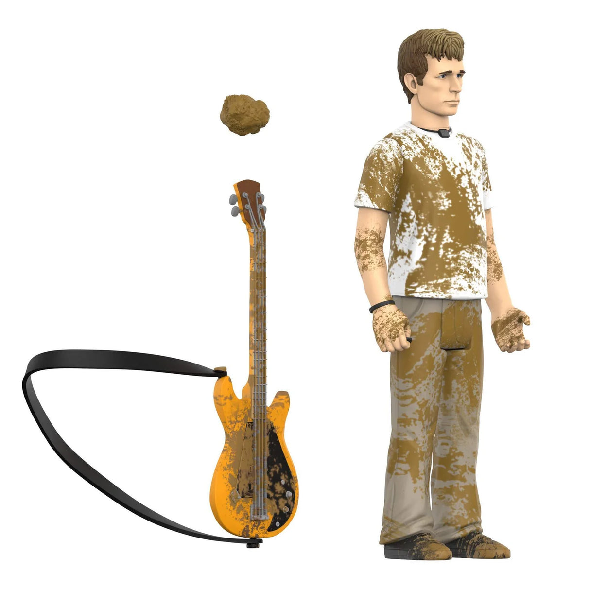 A collectible action figure of a young man with brown hair, wearing a white t-shirt and gray pants covered in brown mud splatters, shown alongside a matching orange electric guitar with a black strap and a separate brown headpiece on a white background.