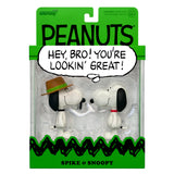 Peanuts figurine packaging with Snoopy and Spike, featuring a speech bubble.