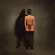 This image features an album cover for "Vultures LP" by Kanye West and Ty Dolla Sign. The cover art depicts a moody and atmospheric scene with two figures standing facing away from the viewer, set against a dark, textured background.