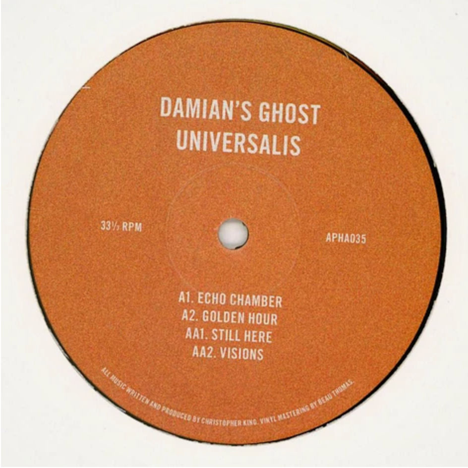 A circular orange vinyl record label with white text reading 'DAMIAN'S GHOST UNIVERSALIS' and track listing details, photographed against a plain white background.