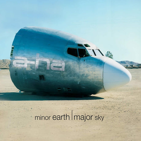 Large airplane fuselage on a desert ground with 'ethereal' branding and text 'minor earth | major sky'.