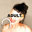 Person with a blurred face and text 'ADULT.' next to a horseshoe on a beige background