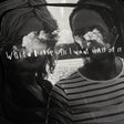 Two people with cloud-like faces and text overlay in a black and white setting.