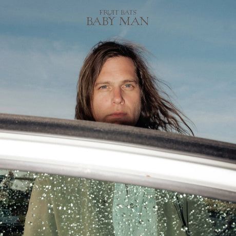 Album cover with a person peeking out from a car window, titled 'Baby Man' by Fruit Bats.