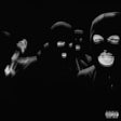 Black and white album cover with masked figures and a parental advisory label.