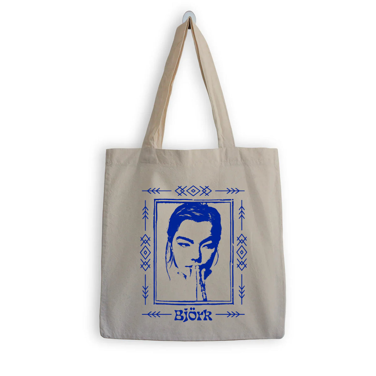 Tote bag with a portrait and 'Bjärk' text on a beige background