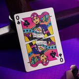 Colorful playing card with a stylized character on a purple surface