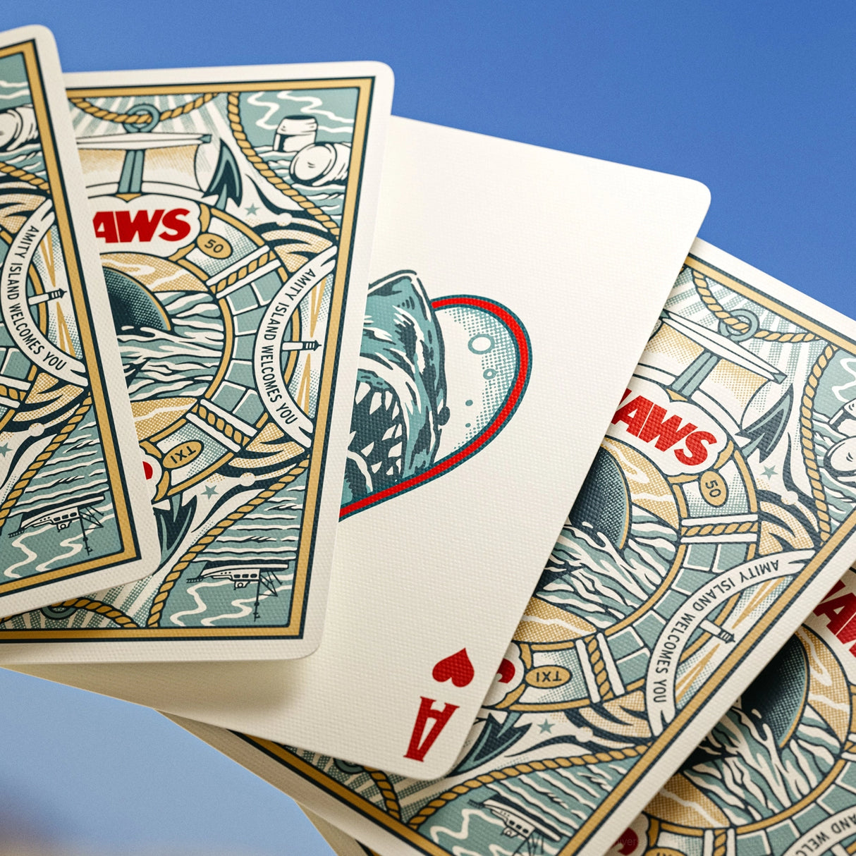 Playing cards with AWS logo and design on a blue background