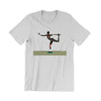 A white short-sleeve crewneck t-shirt featuring a graphic print of a person in a black and red athletic outfit performing a yoga pose on a balance board, set against a plain white background.