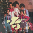 Jackson 5 'Santa Claus Is Comin' To Town' vinyl record cover, featuring the five members posing in front of a Christmas tree and fireplace. The large yellow 'Jackson 5' logo overlays the center, and the Motown logo is in the top right corner.