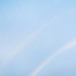Partial rainbow in a blue sky
