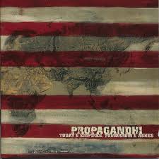 Album cover with a stylized map and text 'Propagandhi' on a red, white, and blue striped background.