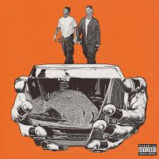 Album cover with a car, hands, and two figures on an orange background