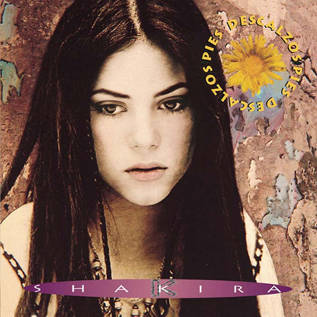 Album cover with a woman's face and text 'Descalzos Descalzas' and 'Shakira'.