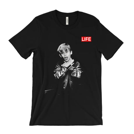 A black short-sleeve crewneck t-shirt featuring a black and white graphic print of a young man in a leather jacket, with a red rectangular box containing the word 'LIFE' printed on the chest.
