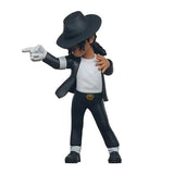 Toy figure of a person in a black outfit with a hat on a white background
