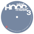 A circular blue-gray label or cover art with large white text reading 'robert music 3' and smaller white text around the edge, shown on a plain white background.